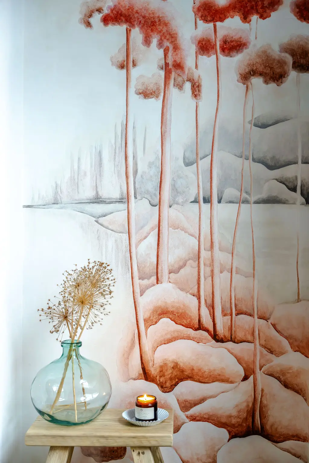 Acrylic mural with red pines, grey mountains, and blue lakes, depicting a Canadian landscape in a sideways view.